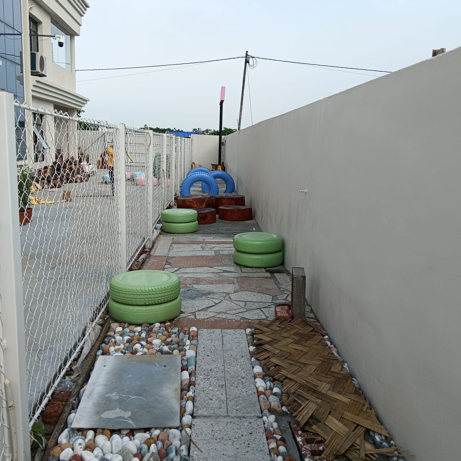 Agility corridor with wood stumps, pebbles, bamboo mat, tyres