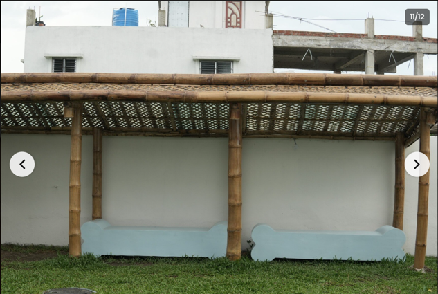 Pergola with bamboo columns, woven roof, cushioned seating
